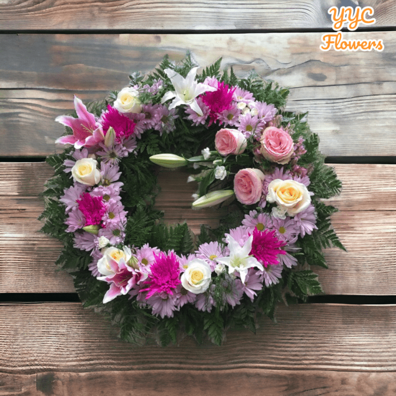 wreath yyc pink and purple roses arrangement